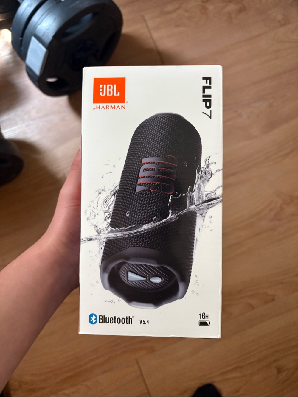 JBL Flip 7 Portable Bluetooth Speaker — Black with Orange Accent